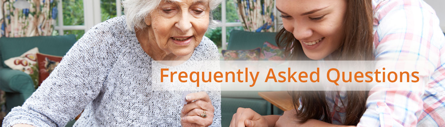 banners-faq Frequently Asked Questions. Recreational therapist having fun with a senior that has mental health issues.